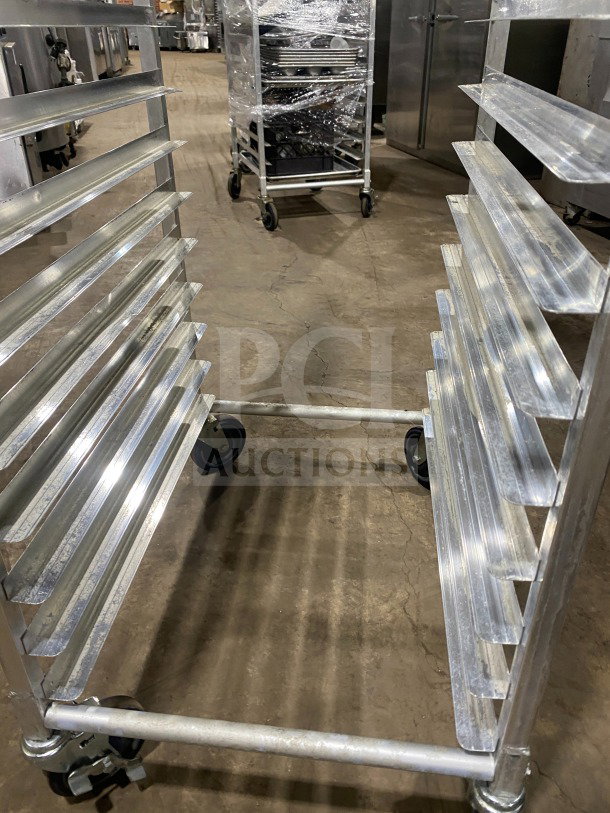 Regency stainless steel bun pan rack, model 109APR1820L, on casters, with welded shelves for heavy-duty use.