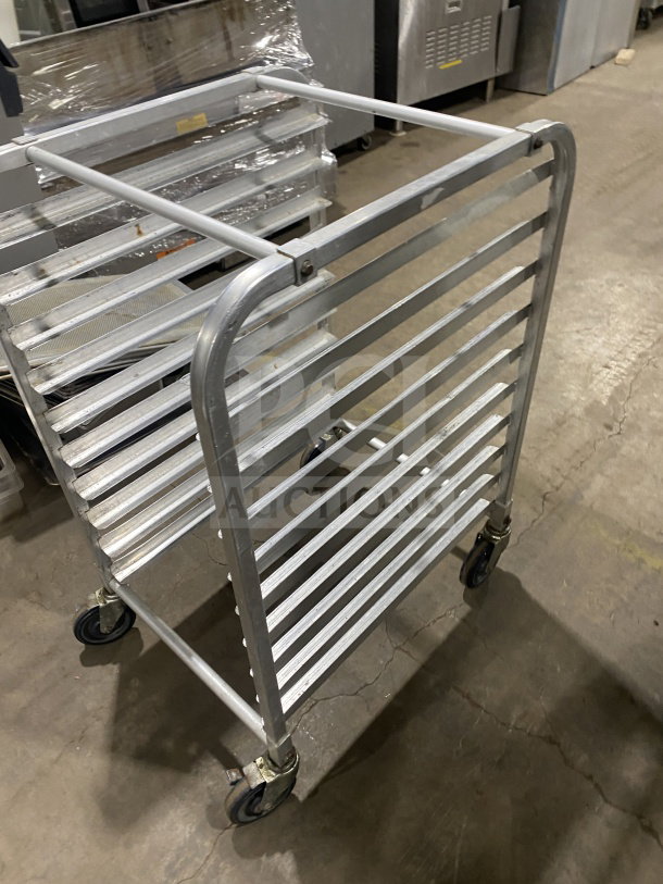 Commercial stainless steel welded 10-pan rack with casters, in good condition. Heavy duty design for bakery use.
