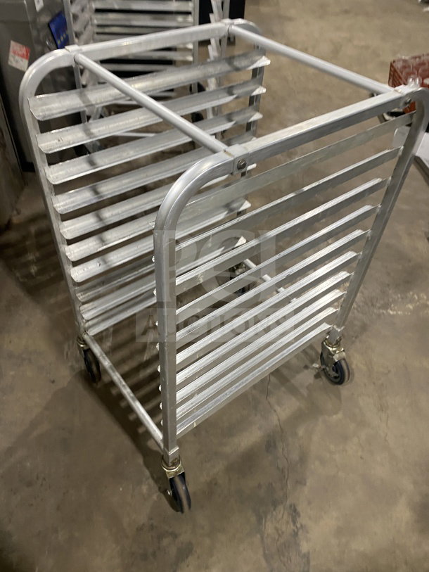 Commercial stainless steel 10-pan sheet rack on casters. Heavy-duty welded construction. Good condition.
