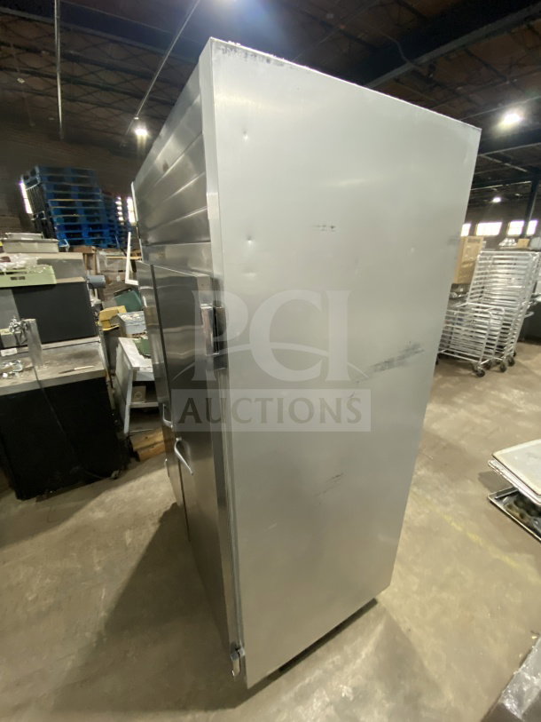 Traulsen G22010 stainless steel 2-door reach-in refrigerator, on casters, features poly-coated wired racks, 115V 1 phase.