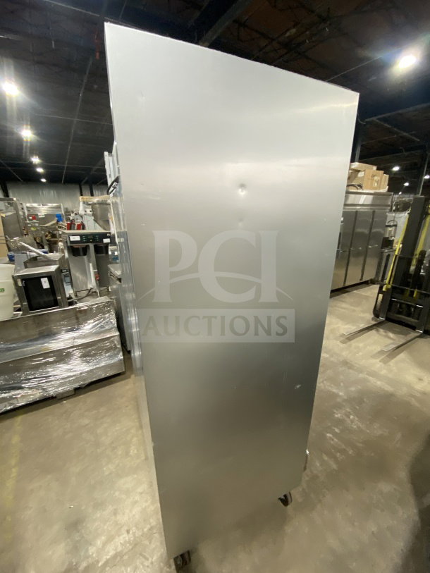 Traulsen G22010 commercial stainless steel 2-door refrigerator, poly coated wired rack, on casters, model G22010.