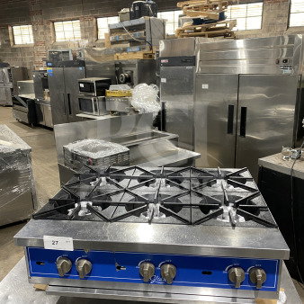 Globe 36" stainless steel gas hot plate with 6 burners, commercial countertop model with legs, excellent condition.
