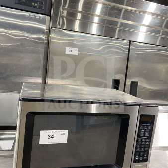 General Electric stainless steel countertop microwave oven, model JES1651SJ02, 120V. Excellent condition with digital controls.