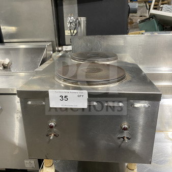 Commercial stainless steel electric hot plate with two solid burners, in used condition. Auction label reads "35 QTY".