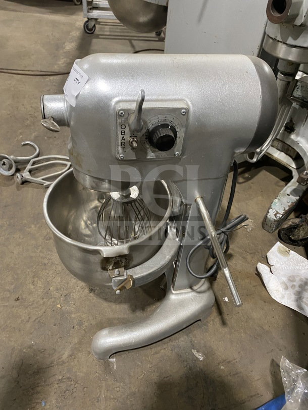 Hobart C100 commercial planetary mixer with paddle attachment, stainless steel mixing bowl. Model C100, SN: 1475997, 115V.
