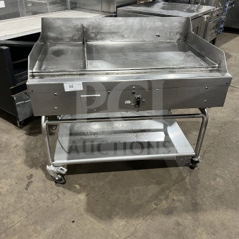 Commercial stainless steel heavy-duty griddle, dual sections, with back and side splash, on casters, good condition.