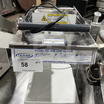 Oliver Model 738 electric countertop gravity-feed mini chip/bagel slicer, white powder-coated stainless steel, SN: 188407, 115V, 1 Phase.