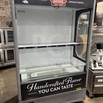 Ojeda ALPA120 open merchandiser display, Dietz & Watson style, pull-down curtain, 120V, good condition, on legs.