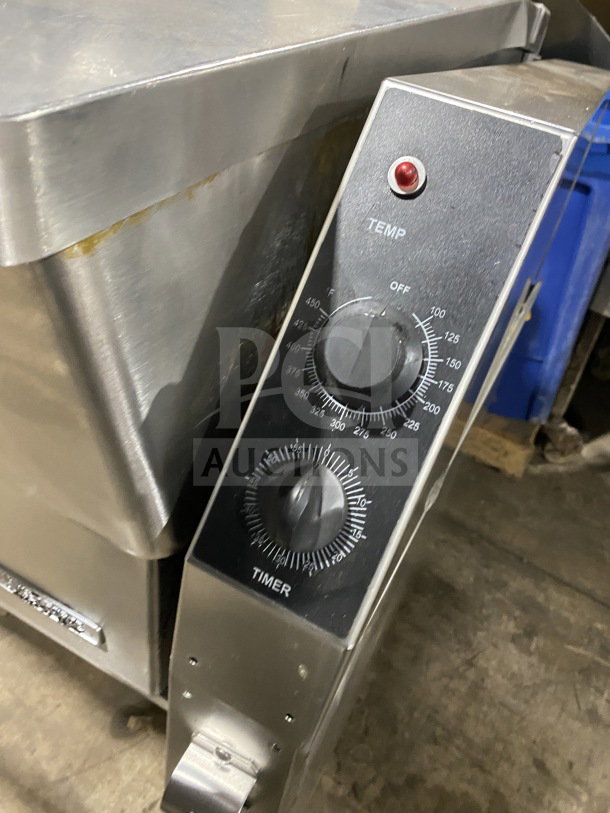Market Forge commercial stainless steel tilting skillet braising pan with single spout faucet and temperature controls.