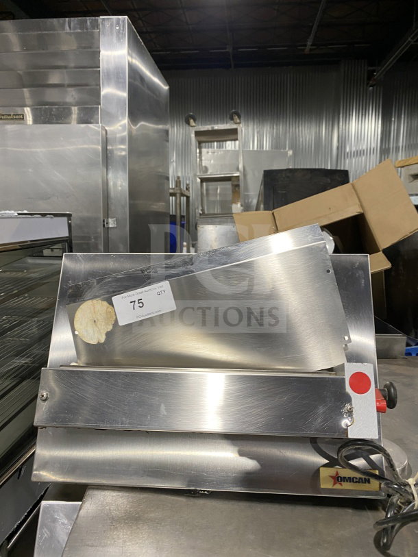 Omcan M42A stainless steel food packaging machine, heavy-duty, electric-powered. Model: M42A, SN: 0195860, 110V. Good condition.