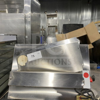 Omcan M42A stainless steel food packaging machine, heavy-duty, electric-powered. Model: M42A, SN: 0195860, 110V. Good condition.