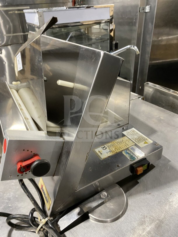Omcan M42A commercial stainless steel food packaging machine, heavy-duty, 110V. Model: M42A, Serial: 0195860, used condition.
