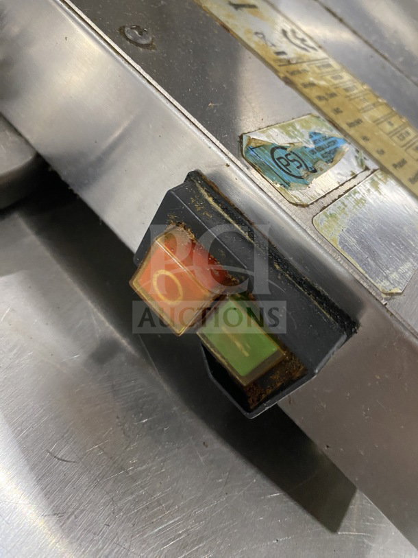 Omcan M42A electric food packaging machine, stainless steel, clearly marked with model and SN 0195860, 110V, in used condition.