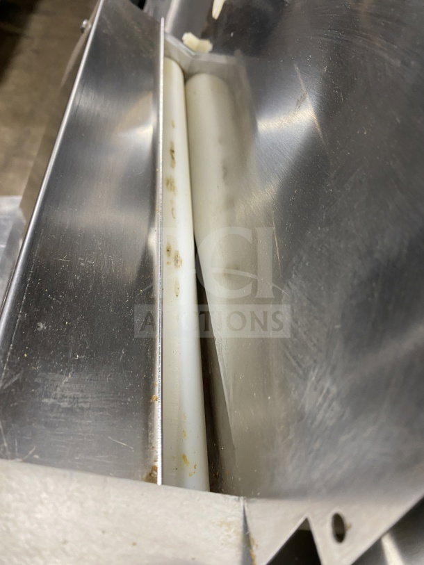 Omcan M42A electric food packaging machine, stainless steel, commercial-grade, showing wear. Model M42A SN: 0195860. 110V.