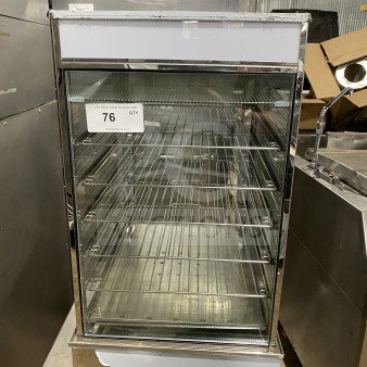 Good commercial countertop heated food steamer, model ESTC-18. Features single-glass door, chrome-plated wire rack. 110V. Some cosmetic wear visible.