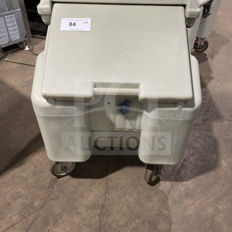 Cambro commercial insulated ice bin on casters, gray, durable, marked with "Cambro." Item tag "84" visible.