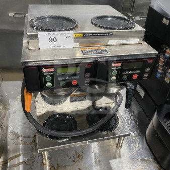 Bunn AXIOM2/2TWIN coffee brewer, stainless steel, digital control, 4 warming plates, on legs, SN: AXTN023831, in used condition.