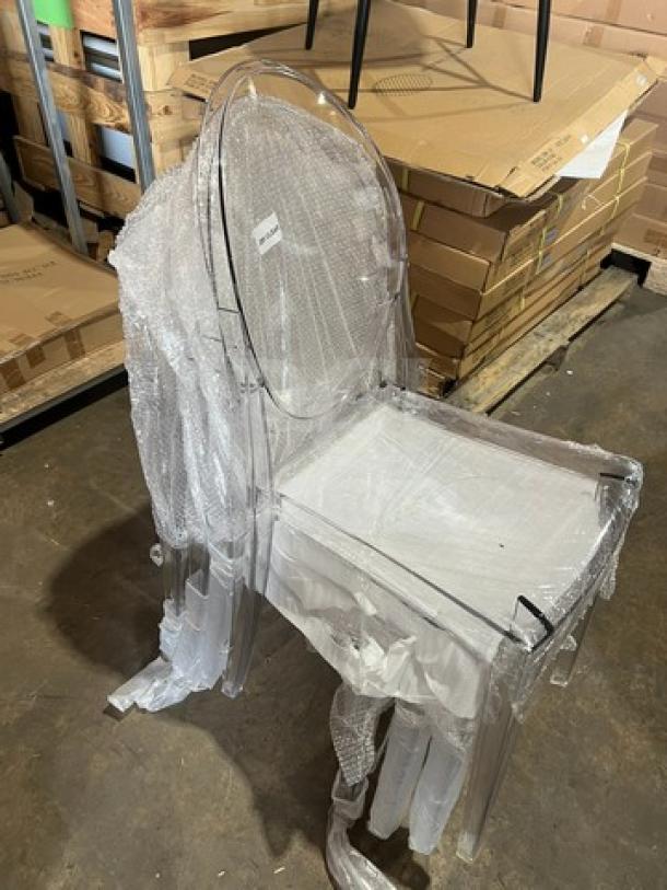 Brand new GA Ghost model transparent stackable dining/patio chair. Wrapped in protective plastic. Indoor/outdoor use.
