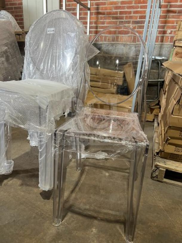 Transparent GA Ghost model stackable dining chair in clear plastic wrap, brand new condition. Ideal for indoor/outdoor use.