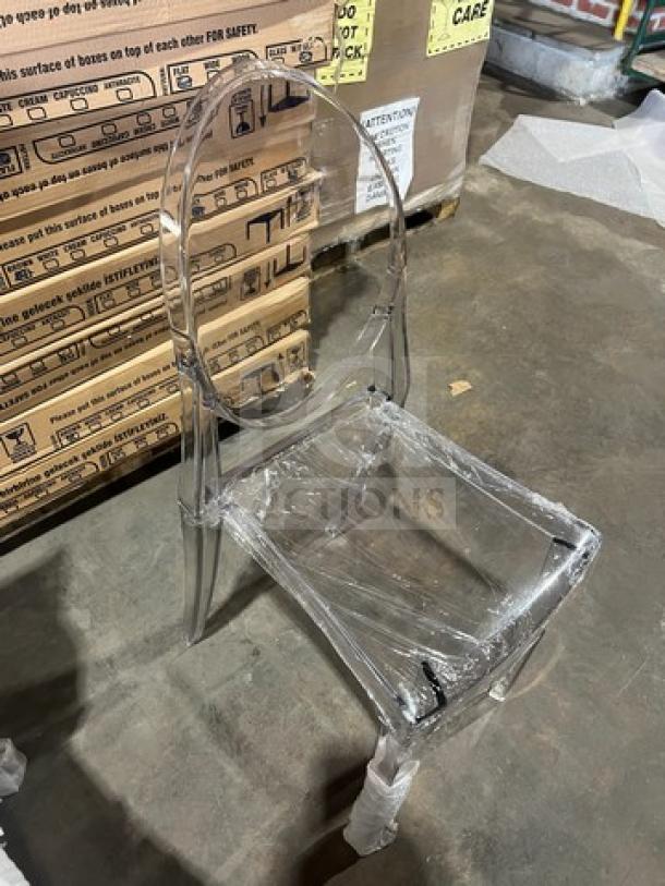 Clear stackable dining chair, GA Ghost model, transparent, brand new condition. Ideal for indoor/outdoor use.