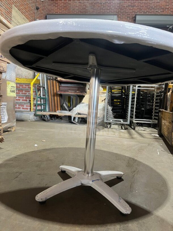 BRAND NEW 42" round composite dining table with barn wood plank design and polished base. Model DW42 by OCS, model DW017.