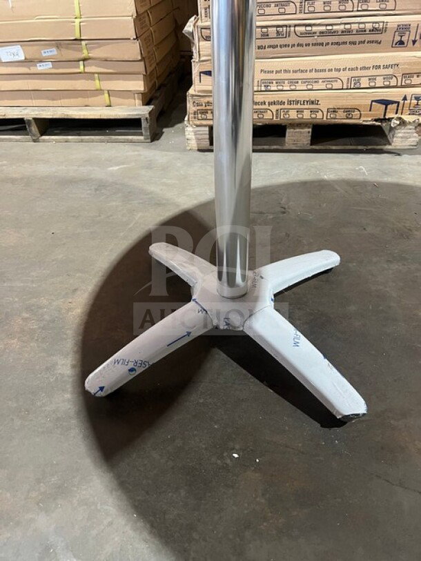 BRAND NEW 42" round OCS DW017 Barn Wood dining table with polished base, featuring composite plank top and chrome finish.