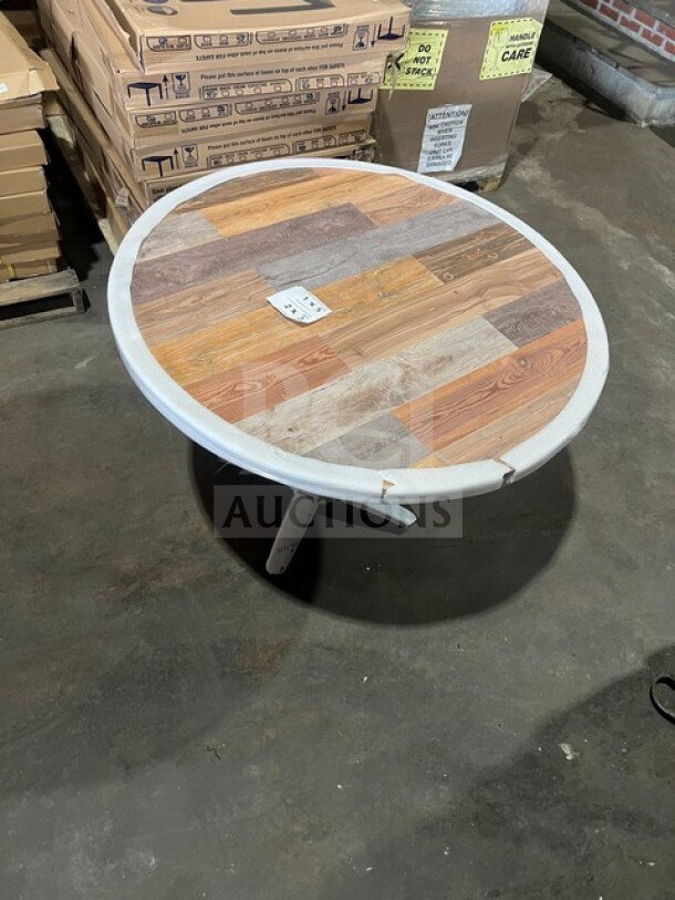 BRAND NEW OCS DW42 round dining table, 42" composite barn wood plank top, polished base, in excellent condition.