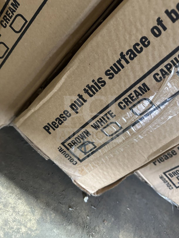 Cardboard box labeled "BROWN WHITE CREAM." Contains a Rainbow Arizona Masa dark brown rattan table. Brand new condition.