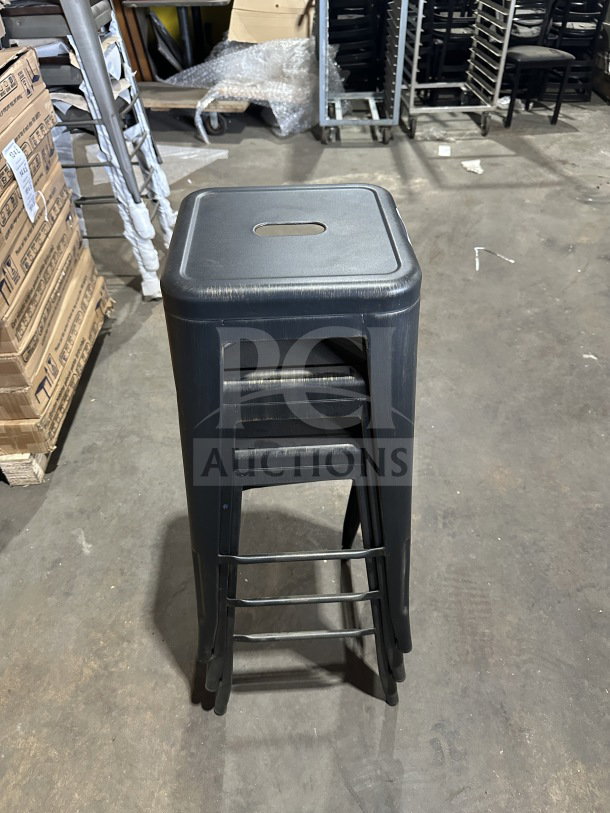 Brand new Astor matte black backless metal counter-bar stool, industrial Tolix-style, stacked, pristine condition.