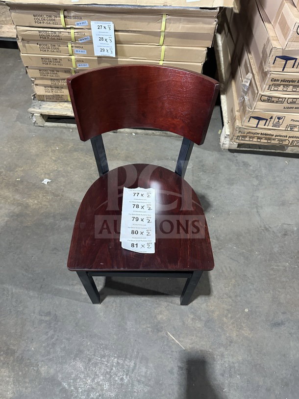 Brand new commercial restaurant chair with mahogany wood veneer back and seat, metal frame. With auction tags displayed.