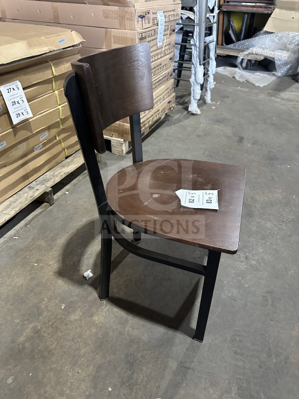 Brand new commercial dark brown restaurant chair with mahogany wood back and seat, veneer seat, and metal frame.
