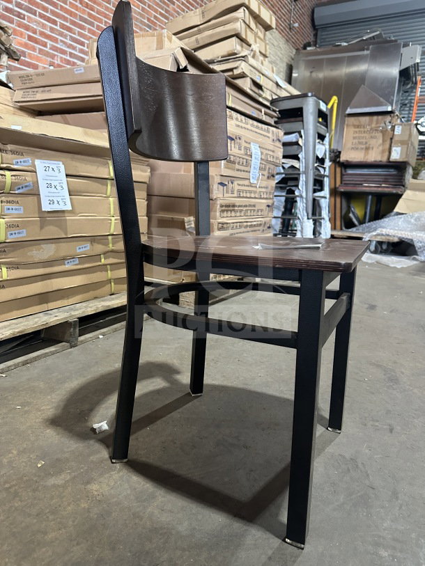Brand new commercial dark brown restaurant chair with mahogany veneer wood back and seat, metal frame.