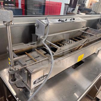 Belshaw Donut Robot® Mark V Automatic Donut Fryer on custom stainless steel stand, used in good condition, with accessories.