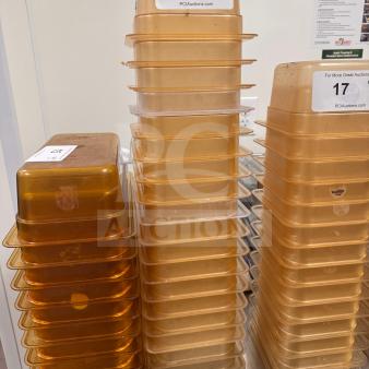 Stacked durable food storage pans, high-quality, labeled 16, 17, 18 from PCIAuctions.com, shown on a stainless steel table.