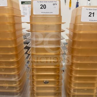 Stacked amber food storage pans, high-quality, durable condition, quantity labels displayed, ideal for commercial use.