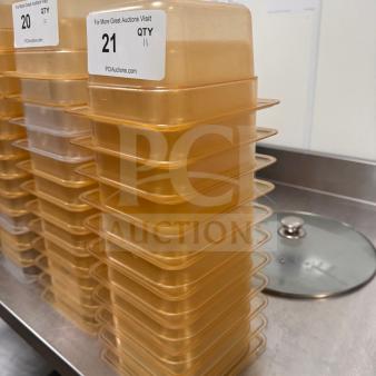 Stack of high-quality, durable food storage pans in excellent condition, labeled with auction information.