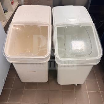 Ingredient storage bins with clear lids and casters, used condition, ideal for kitchen organization.