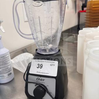 Oster Blender with All-Metal Drive, in good condition, features measurement markings and power dial; auction label visible.