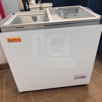 Galaxy Equipment Freezer Showcase, model 177ICFF7HC. Good working order, visible wear from use, Galaxy logo on side.