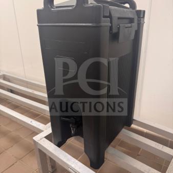 Black insulated beverage dispenser in excellent condition, with minimal wear. Features include sturdy handles and a spigot.