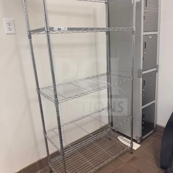 Heavy-duty wire shelving unit, commercial storage rack, pre-owned, minimal wear, clean and ready to use.