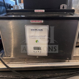 Server Essentials ConserveWell Heated Utensil Holder, Model CW-T, used but in good condition. "Caution Hot" labels visible.
