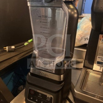 Ninja blender in used good condition, featuring a large capacity pitcher, measurement markings, and control panel.