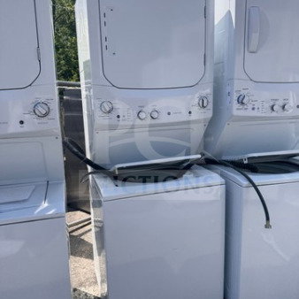 GE 24" Spacemaker stacked washer and electric dryer combo in white, new open box. Features visible control panels and hoses.