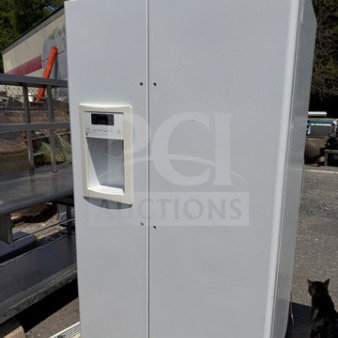 White GE side-by-side refrigerator with water and ice dispenser, missing handle, used condition, minor wear, tested working.