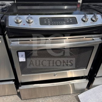 GE Profile electric range oven with glass cooktop, gently used with visible wear, stainless steel finish, model details visible.