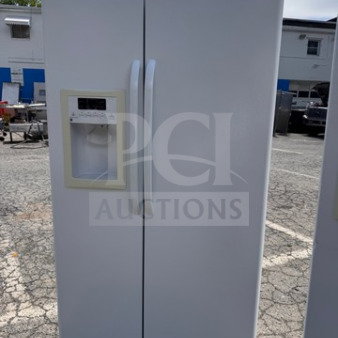White GE side-by-side refrigerator with water and ice dispenser, used condition, minor wear, tested and working.
