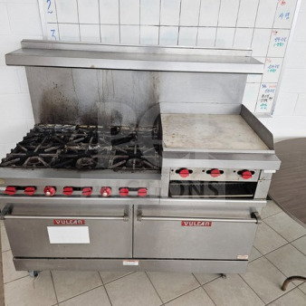 Vulcan 6-burner commercial gas range with oven and 24" griddle, stainless steel exterior, surface stains, in nice condition.