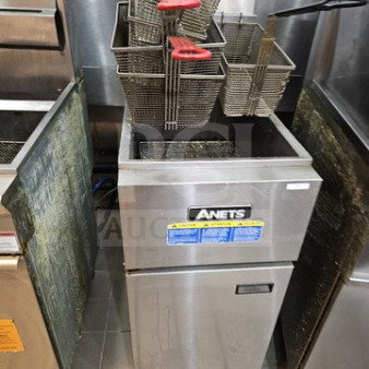 Anets SLG50 gas fryer, 50lbs capacity, with 2 baskets. Stainless steel, very nice condition. Model label visible.