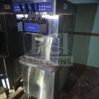 Max Ice M-320T soft serve ice cream machine, stainless steel, sold as is, unknown working condition, dual dispensers, visible controls.